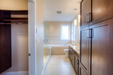 Inspiration for a huge modern master white tile and ceramic tile ceramic tile bathroom remodel in Other with an undermount sink, shaker cabinets, dark wood cabinets, quartzite countertops, a one-piece toilet and beige walls