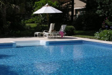 Inspiration for a large transitional backyard pool remodel in Miami