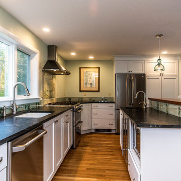 Dual level island with a microwave and a dual zone wine cooler.