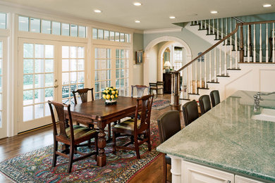 Mid-sized elegant l-shaped dark wood floor and brown floor eat-in kitchen photo in Dallas with an undermount sink, raised-panel cabinets, white cabinets, granite countertops, beige backsplash, mosaic tile backsplash, stainless steel appliances and an island