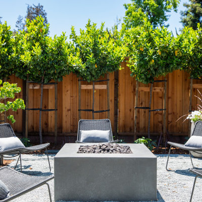 Inspiration for a large country backyard gravel patio remodel in San Francisco with no cover