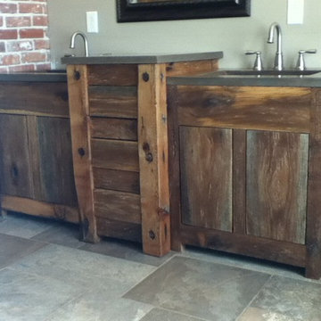 Reclaimed barnboard cabinets with concrete tops
