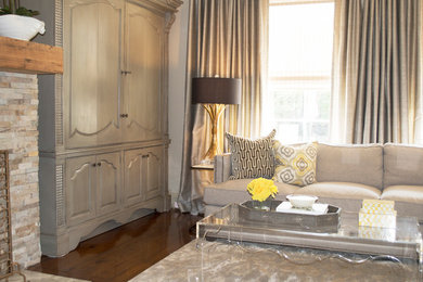 Inspiration for a mid-sized transitional formal and open concept dark wood floor living room remodel in New Orleans with beige walls, a standard fireplace and a stone fireplace