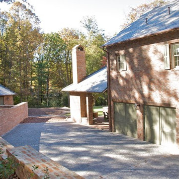 Sideyard View - Two carriage house doors and an entry door