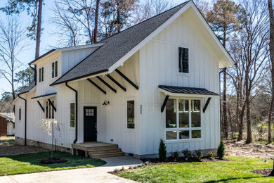 Mid-sized country two-story concrete fiberboard exterior home idea in Raleigh with a mixed material roof