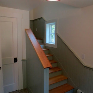 他の地域の片開きドアトランジショナルスタイルのおしゃれな玄関ロビー (御影石の床) の写真