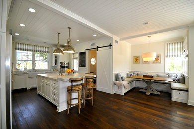 Inspiration for a coastal l-shaped dark wood floor open concept kitchen remodel in Los Angeles with a single-bowl sink, recessed-panel cabinets, cement tile backsplash and an island