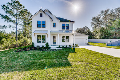 Example of a mid-sized country white two-story concrete fiberboard exterior home design in Jacksonville with a shingle roof