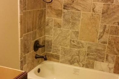 Inspiration for a mid-sized timeless 3/4 beige tile and stone tile ceramic tile bathroom remodel in Atlanta with recessed-panel cabinets, dark wood cabinets and beige walls