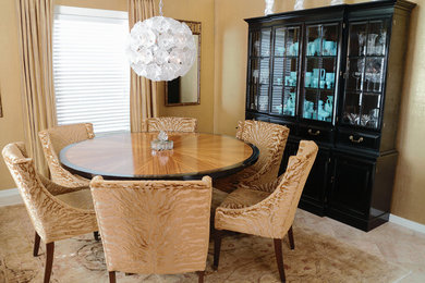 Photo of a mid-sized traditional separate dining room in Other with beige walls, travertine floors and beige floor.