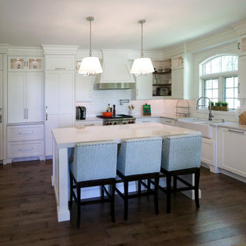 White Kitchen with Gray Quartz Countertops, Farmhouse Sink and Hardwood Floors