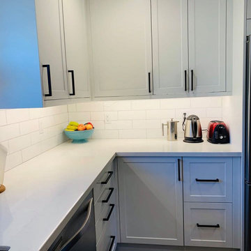 ikea white cabinets with subway tile backsplash and floating shelves