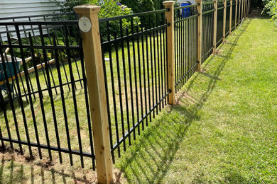 Photo of a craftsman metal fence landscaping in Other.