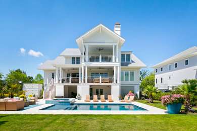 Inspiration for a coastal white three-story exterior home remodel in Charleston with a metal roof and a gray roof