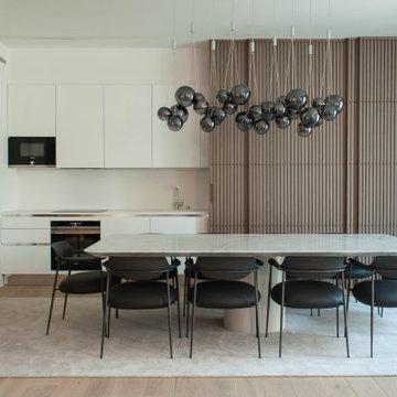 Avenida da Liberdade dining room with stone table and smoked-glass suspension