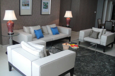 This is an example of a mid-sized contemporary open concept living room in Other with a freestanding tv.