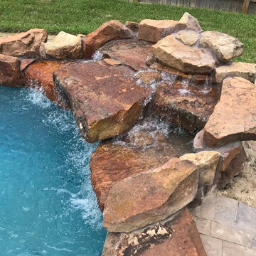 Cozy Lagoon pool with jump rocks and waterfall