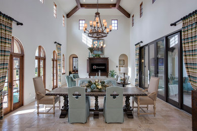 Inspiration for a large mediterranean open plan dining in Orlando with white walls, travertine floors and beige floor.