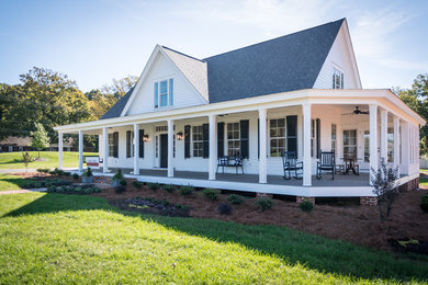 Inspiration for a large cottage white two-story concrete fiberboard house exterior remodel in Other with a shingle roof