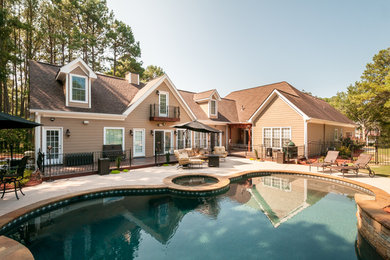 Inspiration for a large timeless backyard custom-shaped and concrete hot tub remodel in Atlanta