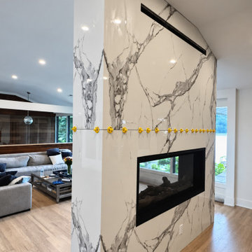CUSTOM FLOOR-TO-CEILING FIREPLACE WITH MITERED RETURNS