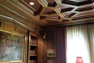 Inspiration for a large victorian enclosed family room library remodel in Houston with brown walls, a standard fireplace, a stone fireplace and no tv