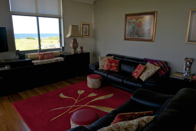 Photo of an asian living room in Wollongong with medium hardwood floors.