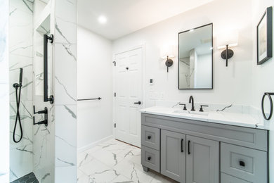 Inspiration for a mid-sized transitional master white tile and porcelain tile porcelain tile, white floor and single-sink bathroom remodel in Bridgeport with shaker cabinets, gray cabinets, a one-piece toilet, white walls, an undermount sink, quartz countertops, white countertops and a built-in vanity