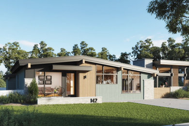 Foto de fachada de casa verde y negra vintage de tamaño medio de una planta con revestimientos combinados, techo de mariposa, tejado de teja de madera y panel y listón