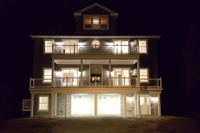 Example of a mid-sized arts and crafts blue three-story exterior home design in New York