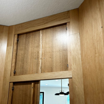 Maple Pecan Stain and Painted Black Kitchen Design in Bettendorf, Iowa