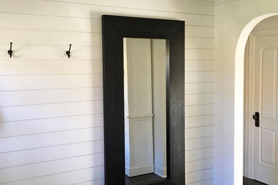 Mid-sized dark wood floor foyer photo in Minneapolis with white walls
