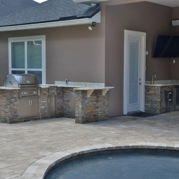Outdoor kitchen with separate server area.