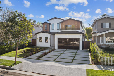 Farmhouse multicolored two-story house exterior photo in Los Angeles with a black roof