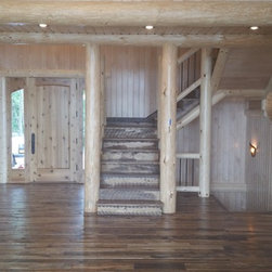 Reclaimed Mixed Hardwood Flooring and Stair Treads in a Log Home Entry - Hardwood Flooring