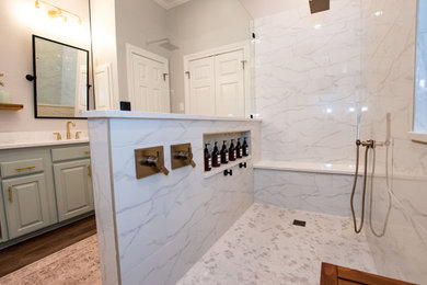Doorless shower - transitional master white tile and porcelain tile double-sink doorless shower idea in Austin with raised-panel cabinets, an undermount sink, quartz countertops, white countertops, a niche and a built-in vanity