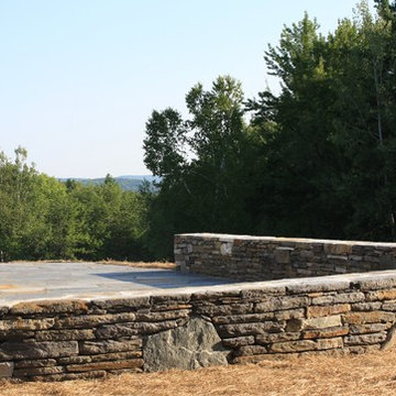 Stone wall and stone patio.