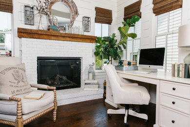 Study room - mid-sized coastal freestanding desk dark wood floor study room idea in Atlanta with white walls, a standard fireplace and a brick fireplace