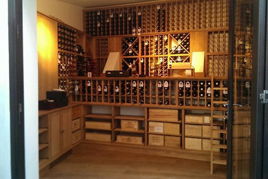 Traditional wine cellar in London with storage racks.