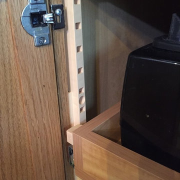 Adjustable pull-out trays added to existing kitchen base cabinets