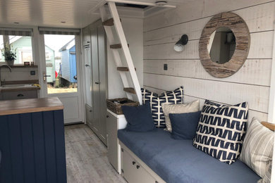Beach style family room photo in Hampshire