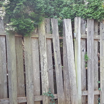 The only thing holding this part up were the neighbor's railroad ties and arbor