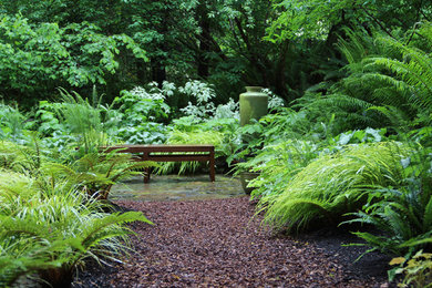Design ideas for a contemporary backyard shaded garden in Seattle with gravel.