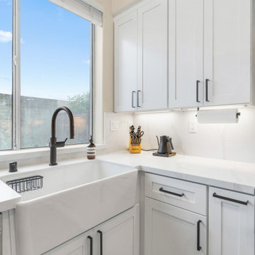 Sleek Modern Kitchen with White Cabinets 2 and High-End Appliances