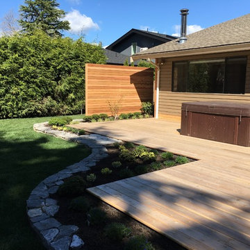 AFTER - Wider view of the deck, hot tub & privacy screen