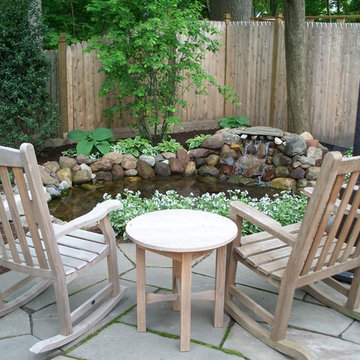 Koi pond with natural bluestone sitting area.