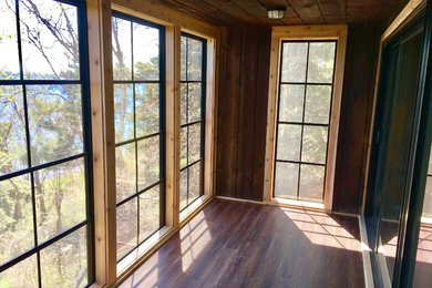 Example of a minimalist sunroom design in Atlanta