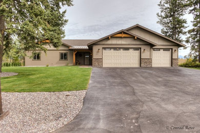 This is an example of a mid-sized rustic partial sun driveway in Other for spring.
