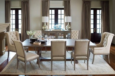 Inspiration for a mid-sized transitional dark wood floor enclosed dining room remodel in Other with white walls, a standard fireplace and a wood fireplace surround
