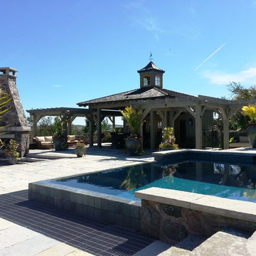 Vanishing edge pool, cabana & fireplace